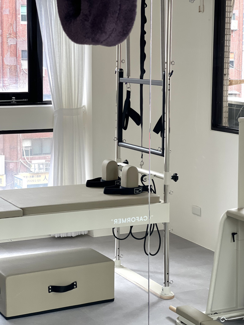 Cadillac and reformer by the window at Mori Pilates